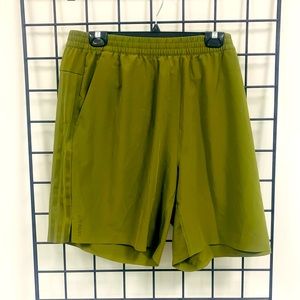 ADIDAS X IVY PARK X PELETON FOCUS OLIVE CRINKLE NYLON SHORTS